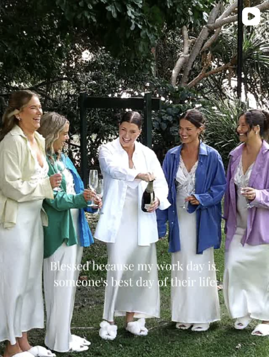 Bridal party in coloured shirts celebrating with champagne on the lawn
