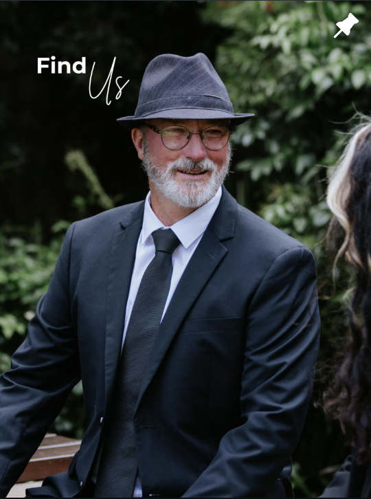 Find us graphic featuring a suited team member outdoors